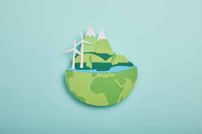 top view of paper cut planet with renewable energy
